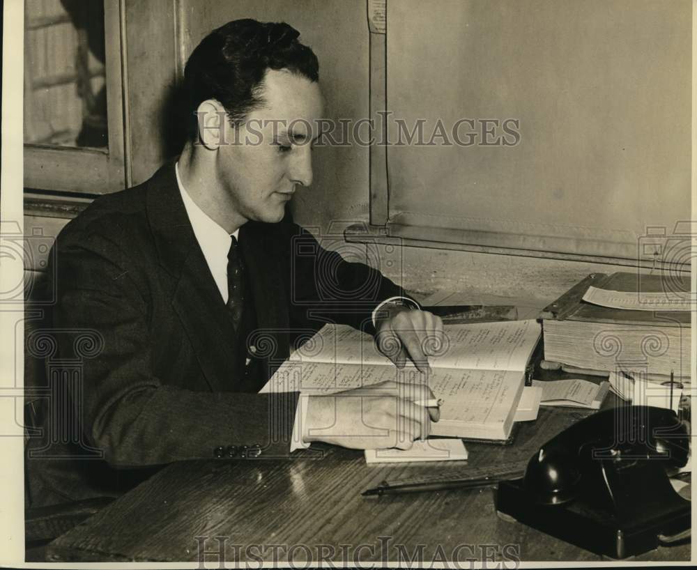 Fred Johanson with ledger at his office-Historic Images