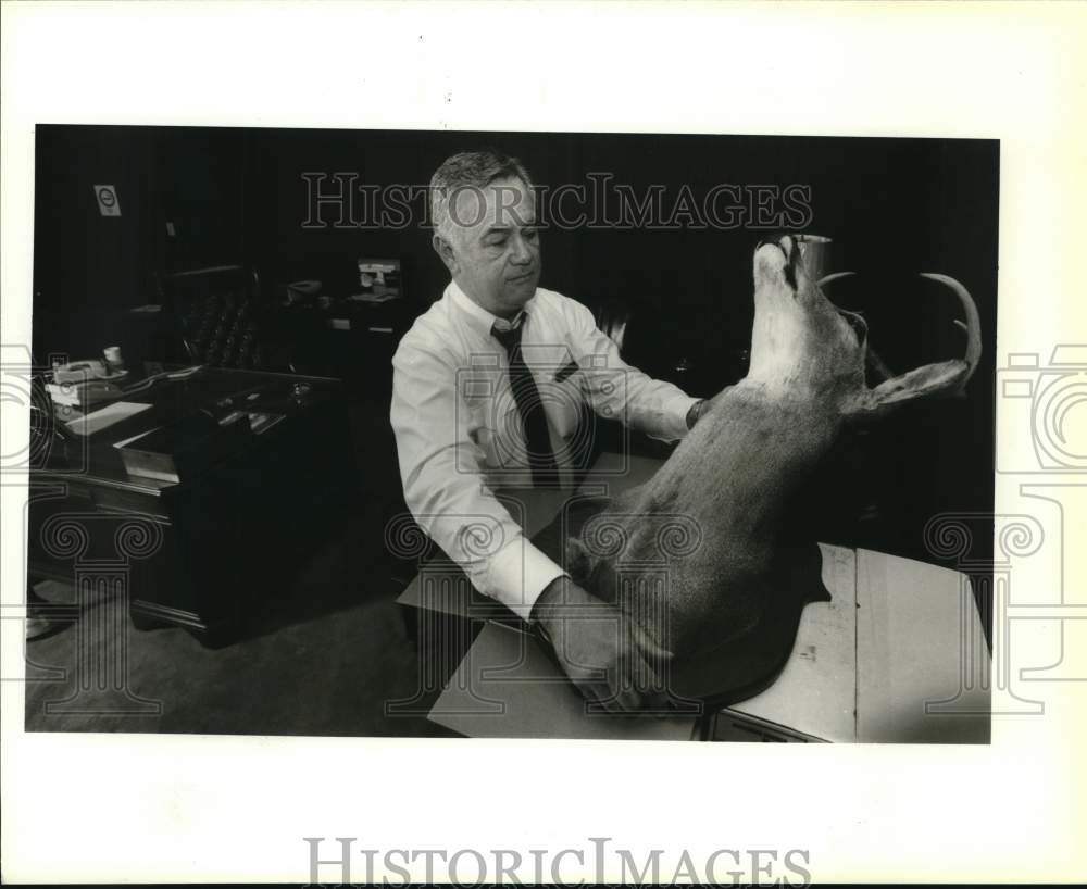 1994 U.S. Marshal Bill Jonas with deer rack from his office, Texas-Historic Images