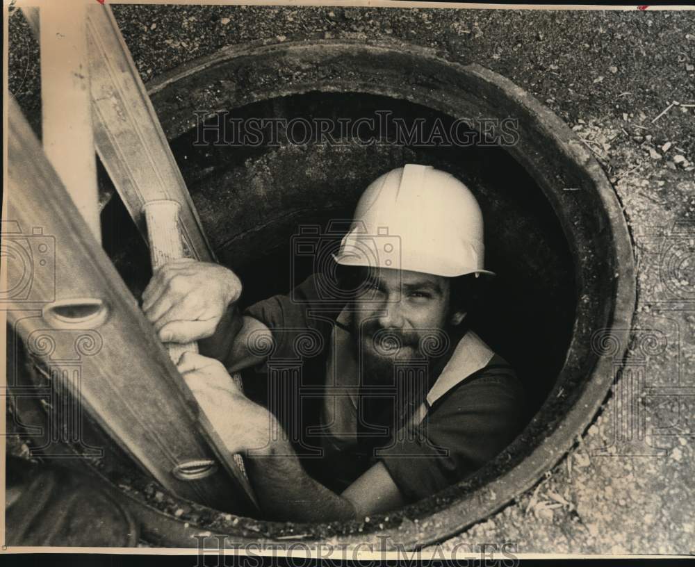 Mike Ullmann climbing out of underground opening-Historic Images