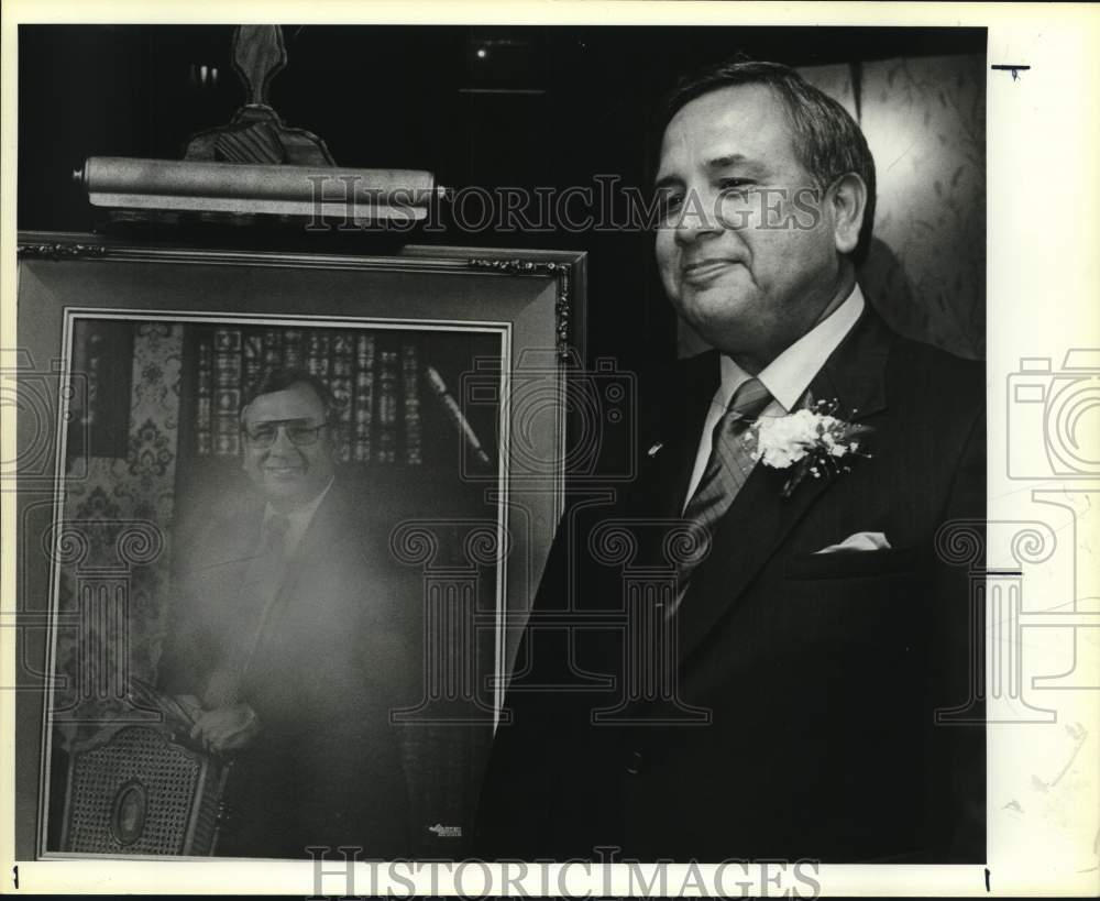 1985 James Vasquez standing next to his portrait, Texas-Historic Images