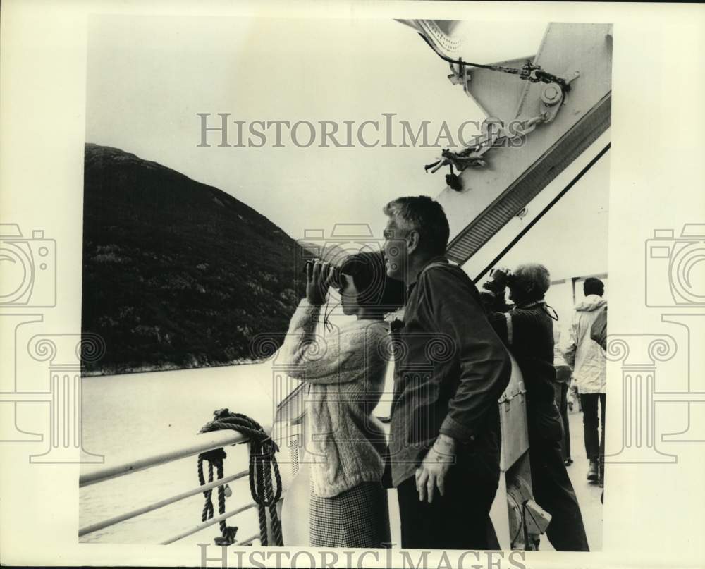 Tourists aboard a cruise ship on Taku river viewing Indian community-Historic Images
