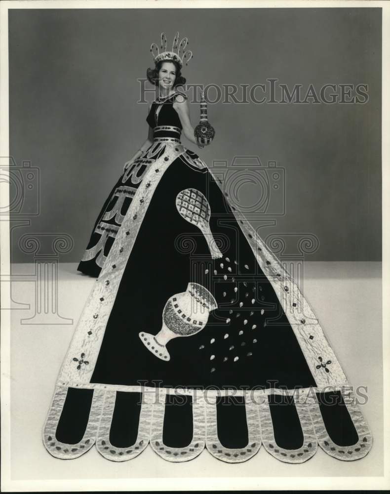 Fiesta royal Diana Townsend wears crown and holds decorative bottle-Historic Images