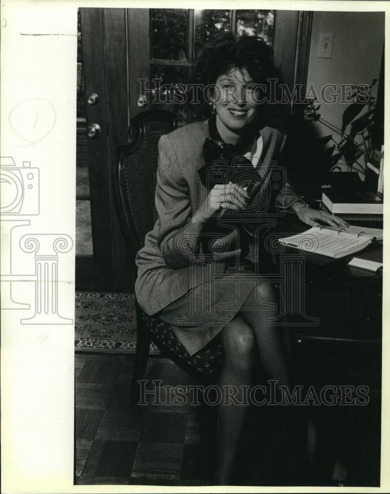 1988 Barbara Troutz sitting at her desk, Texas-Historic Images