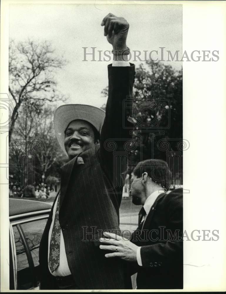 1988 Jesse Jackson waves to crowd after rally at IWC, Texas-Historic Images