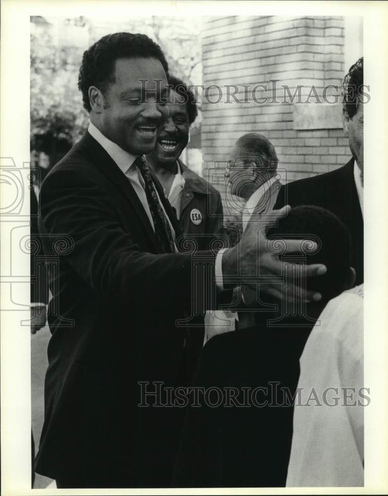 1986 Jesse Jackson greets supporters outside St Patrick&#39;s church, TX-Historic Images