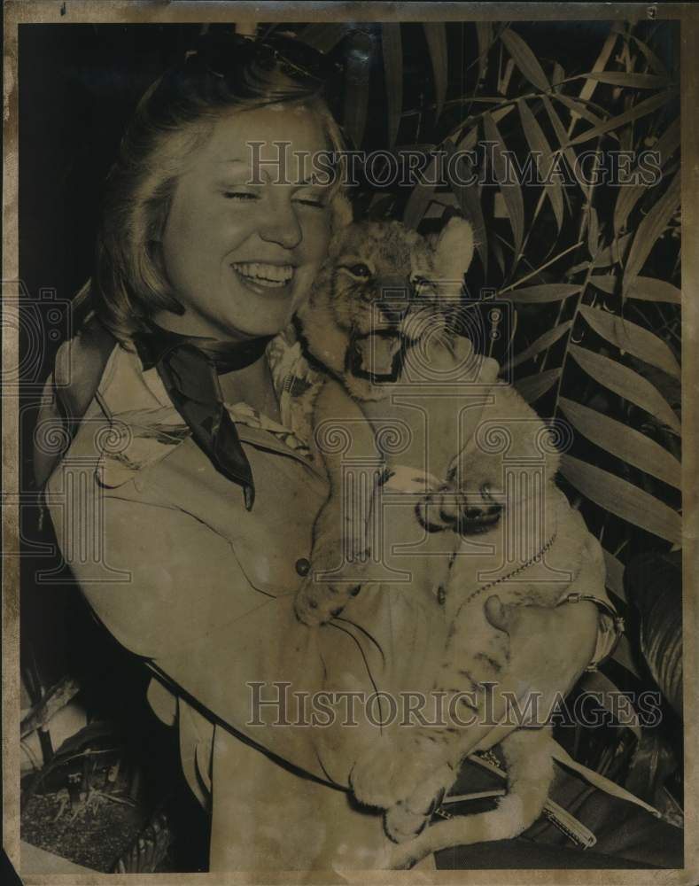 1975 Lion Country Safari's Julie Veatch snuggles with lion cub.-Historic Images