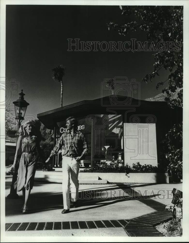 Couple stroll along Palm Springs, California Palm Canyon Drive-Historic Images