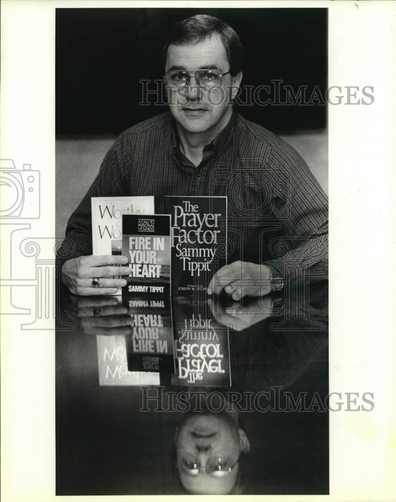 1989 Reverend Sammy Tippit with books he has written, Texas-Historic Images