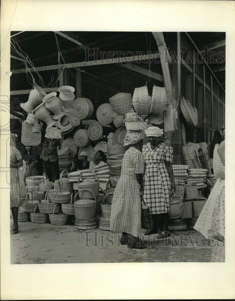 Women confer at Bolivia outdoor market.-Historic Images