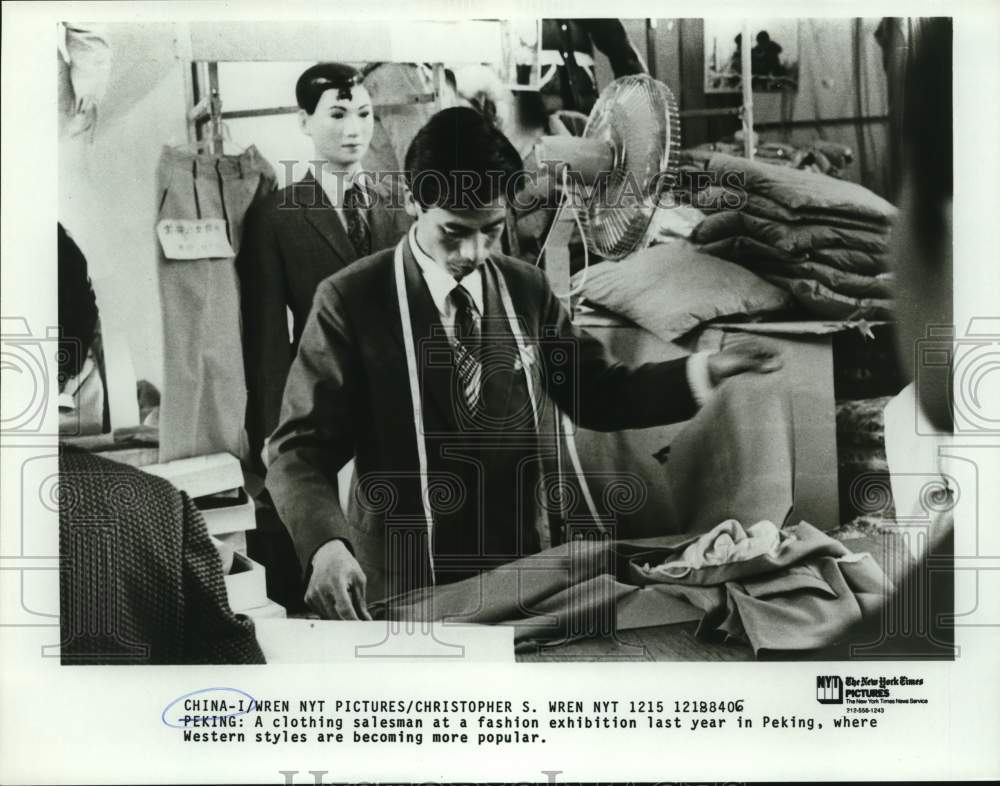 1983 Chinese clothing salesman at Peking fashion exhibition.-Historic Images