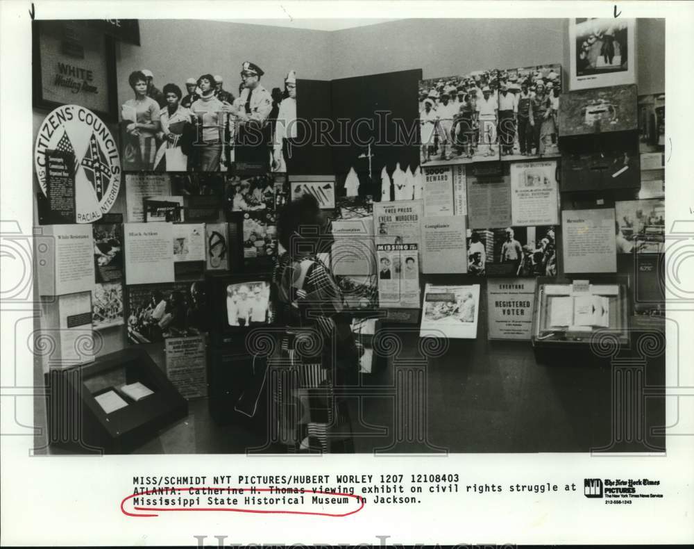 1984 Catherine Thomas views Mississippi State Museum exhibit-Historic Images