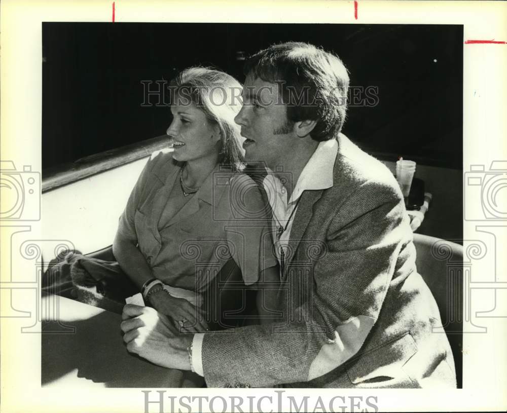 1983 Dr. L.N. and Melody Weems enjoy Nuevo Laredo Downs dog races-Historic Images