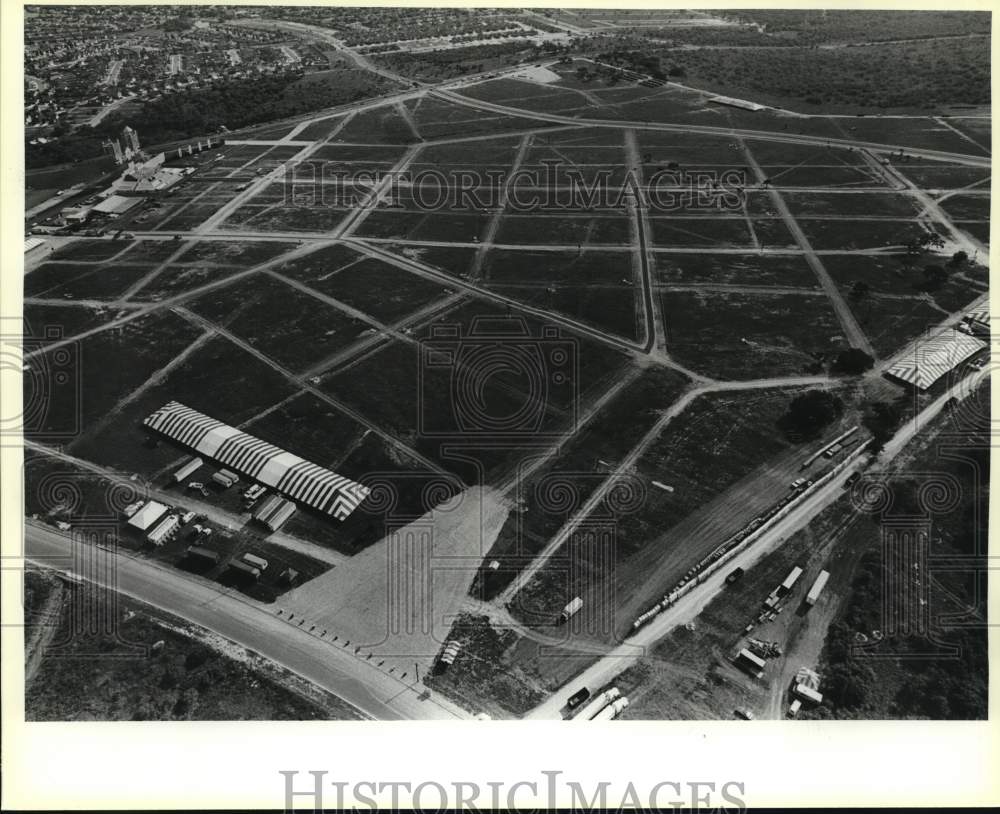 1987 Aerial view of Mass site with altar and port-a-johns-Historic Images