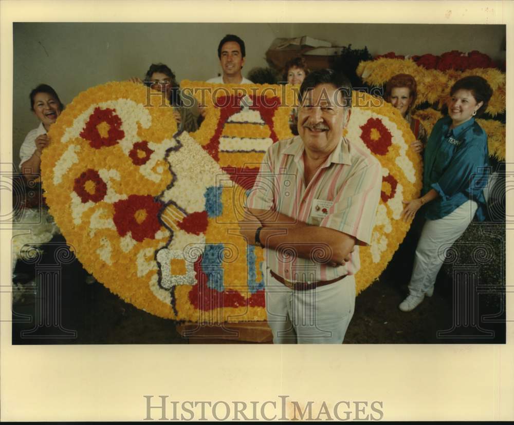 1987 Edmund Perez poses with Vatican seal floral arrangement-Historic Images