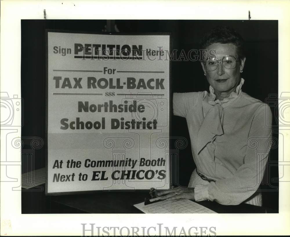 1987 Mary Kidd holds Northside Role Back taxes petition sign-Historic Images