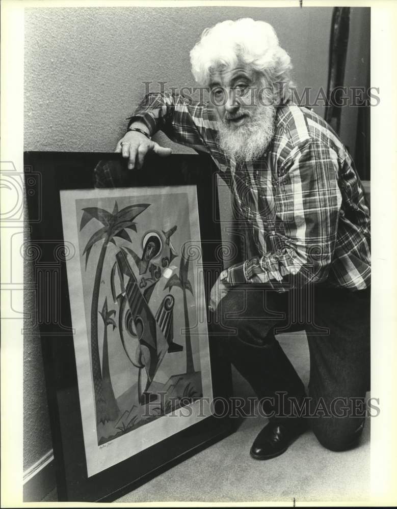 1987 Robert L. B. Tobin displays art.-Historic Images