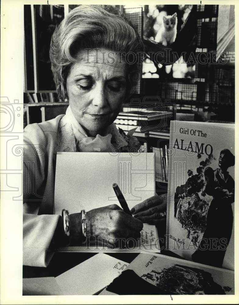 1984 Rita Kerr, Author of &quot;Girl of the Alamo,&quot; signing book, Texas-Historic Images