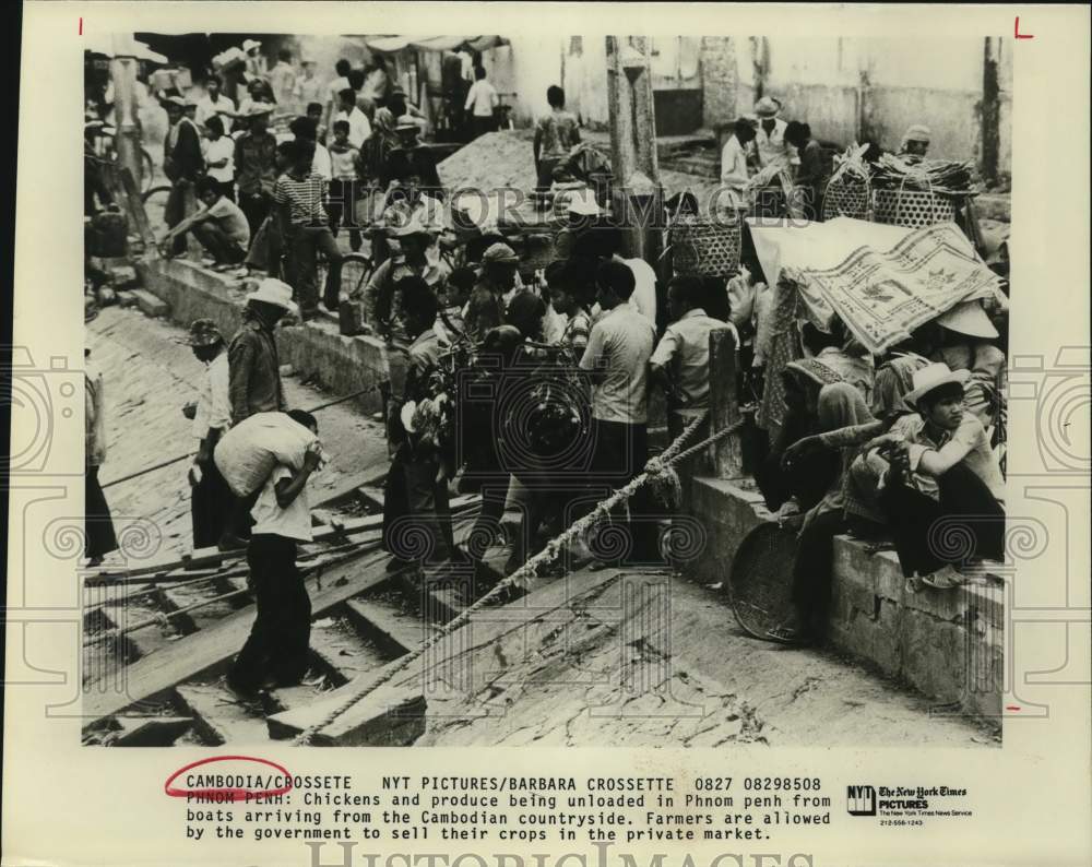 Chickens and produce being unloaded in Phnom Penh, Cambodia-Historic Images