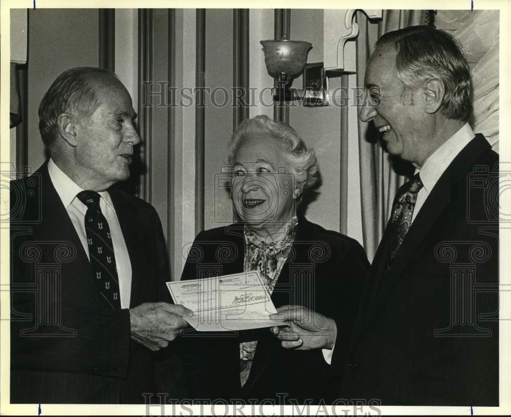 1984 Dr. Frank Harrison receives check from Charles Katz at Ariel-Historic Images