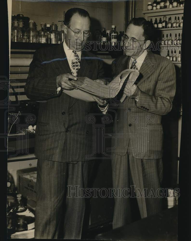 William M. Hammond conferring with his colleague-Historic Images