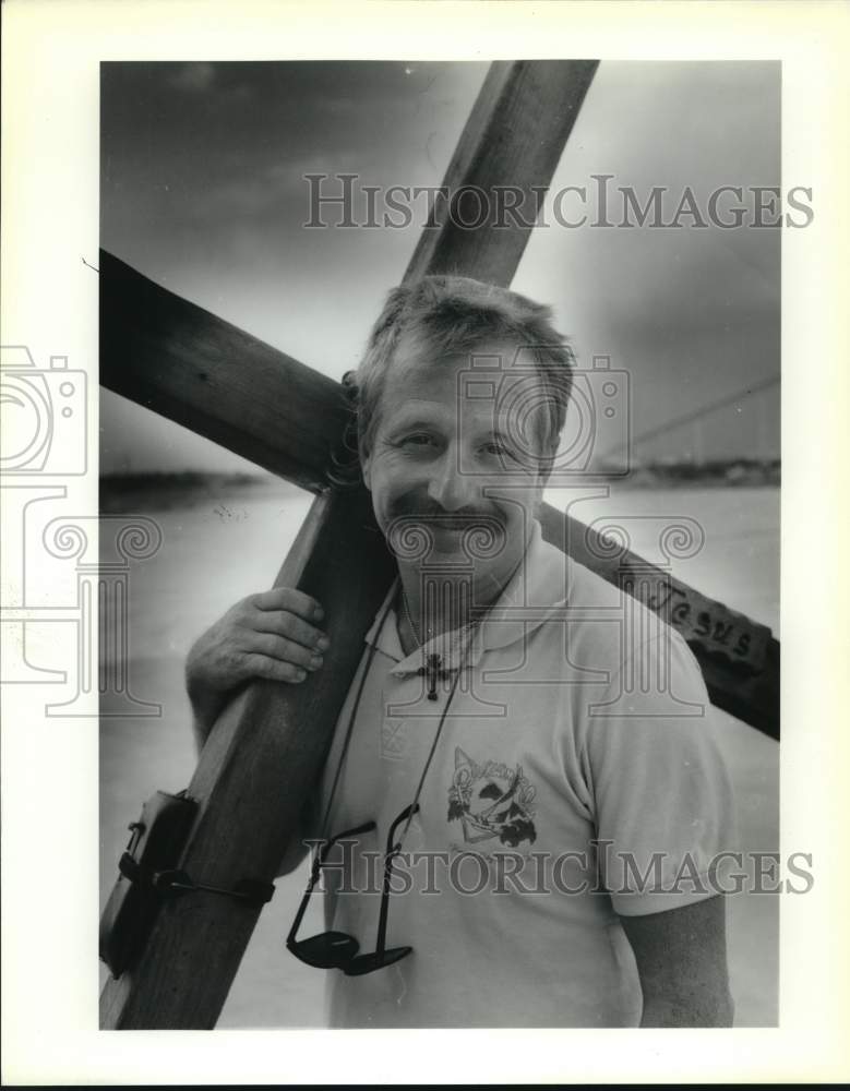 1990 Robert Hancock with a cross that he carries across the country-Historic Images