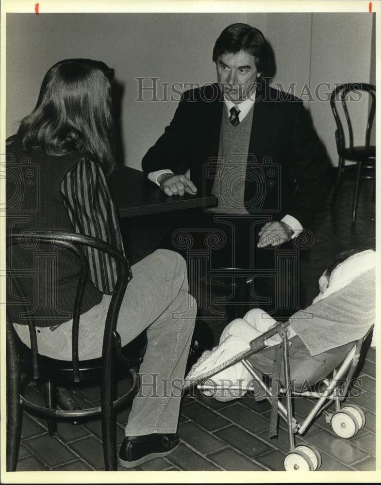 1985 Rodney Harbaugh with parent and child at First Baptist Church.-Historic Images