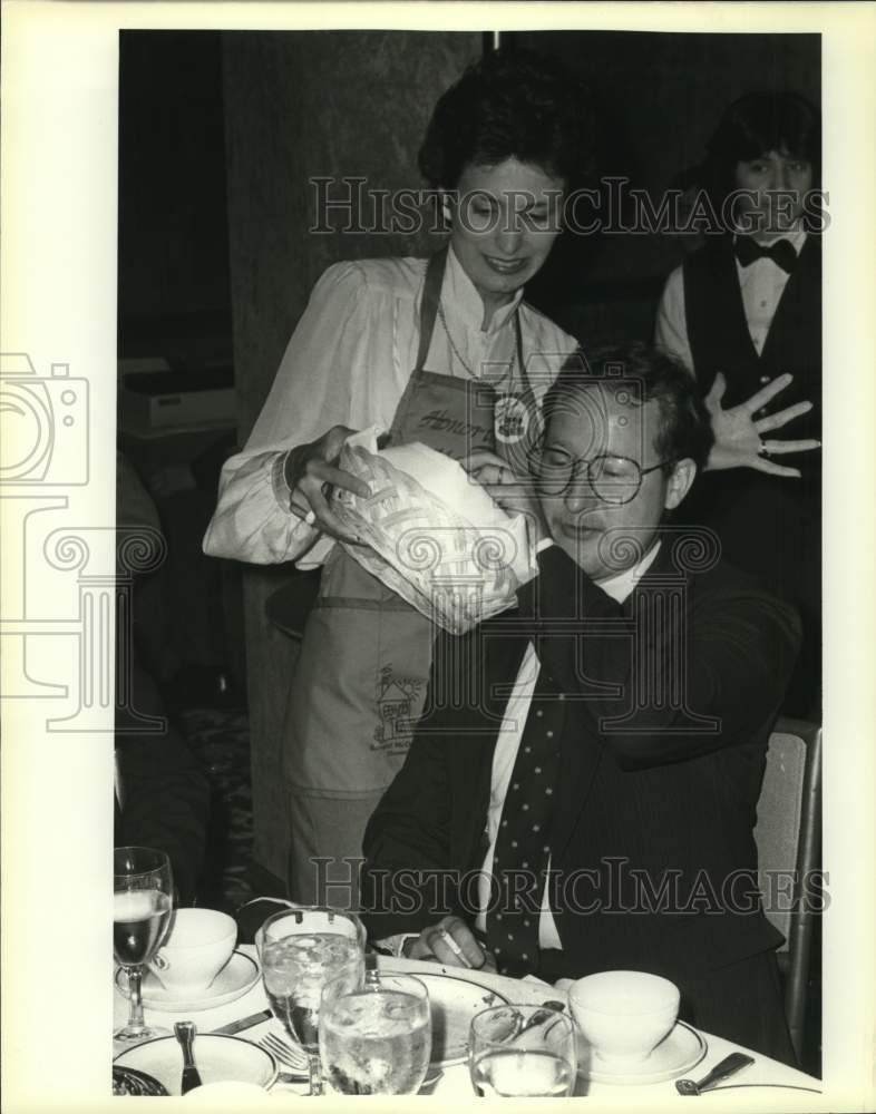 1983 Mary Alice Cisneros serves Bob Jones at St. Anthony Hotel.-Historic Images