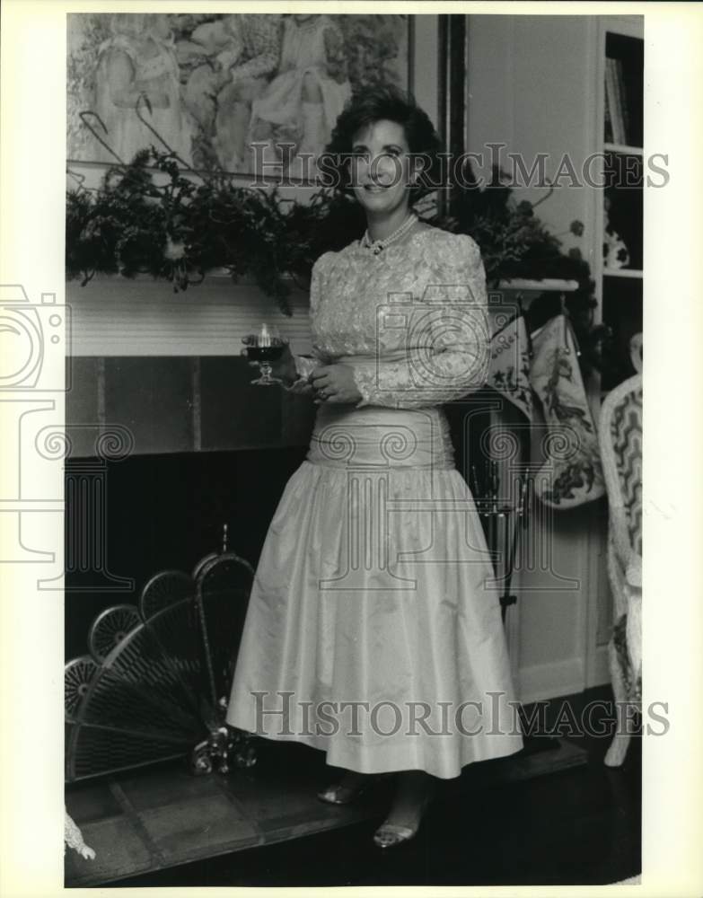 1986 Jan Hill standing in front of fireplace, Texas-Historic Images