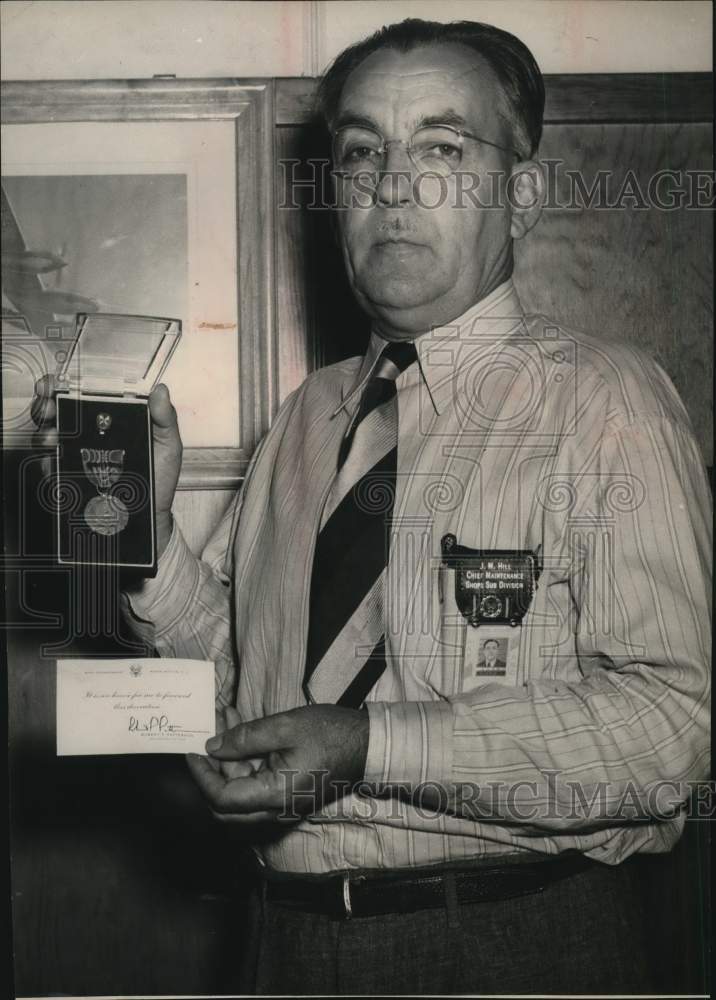 James H. Hill displaying his commendations-Historic Images