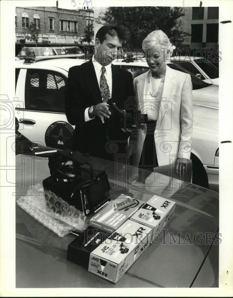 1992 Steve Hilbig receives video camera donation from Gloria Craven-Historic Images