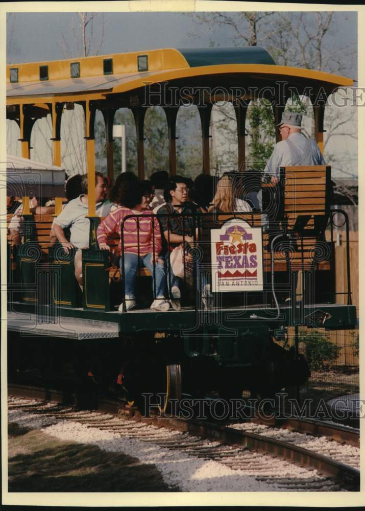 1992 Visitors to Fiesta Texas, San Antonio, ride the train-Historic Images