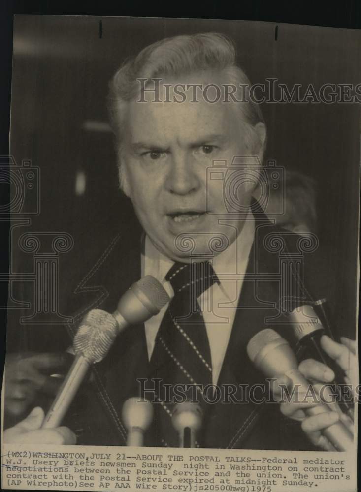 1975 Federal Mediator W. J. Usery talking with newsmen, Washington-Historic Images