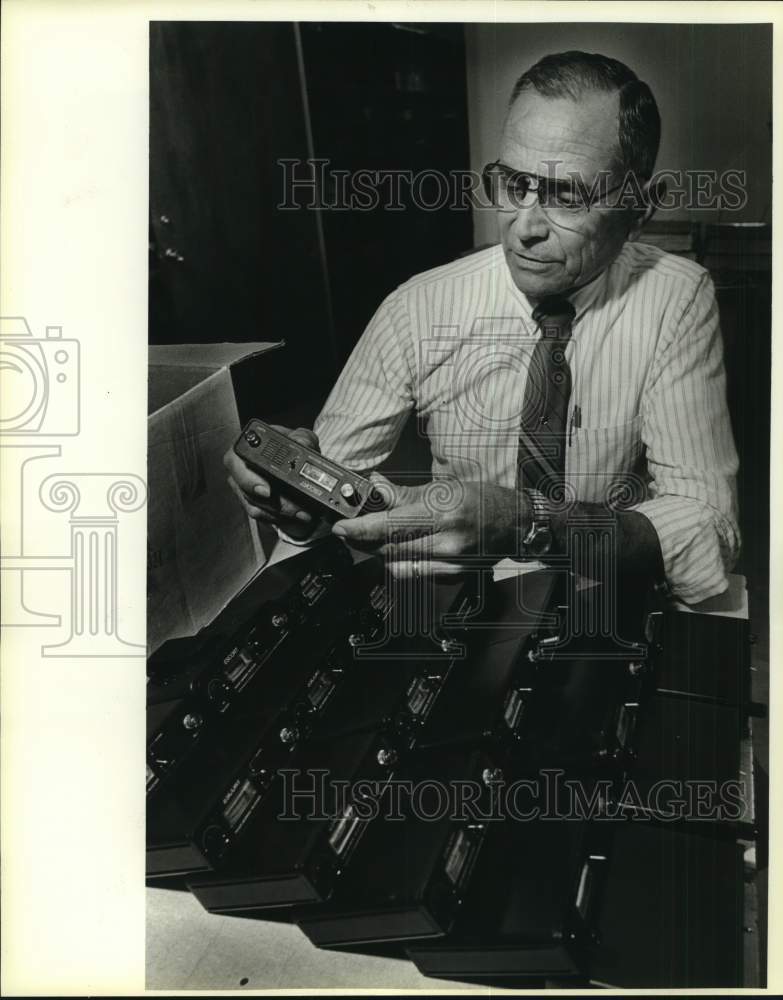 1985 Sergeant Vincent Hons holding stolen Radar Fuzz Buster, Texas-Historic Images