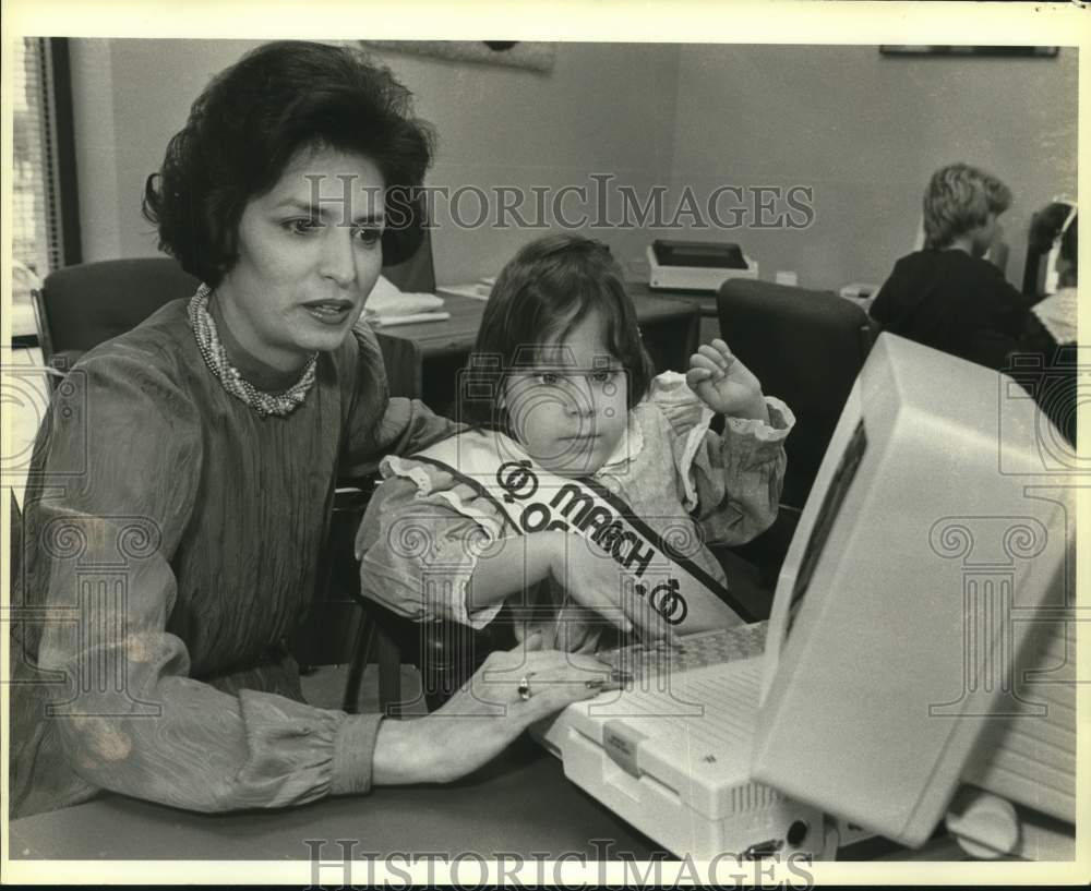 1984 Mary Alice Cisneros at computer with Amber Grothues, Texas-Historic Images
