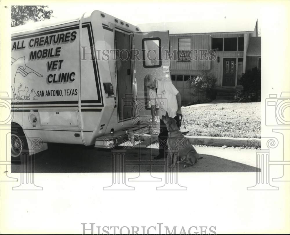 1988 Dr. John Hightower, veterinarian, with dog at his mobile office-Historic Images