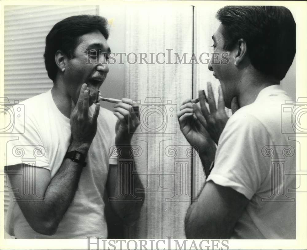 1989 Henry Cisneros shaving before end of day events, Texas-Historic Images