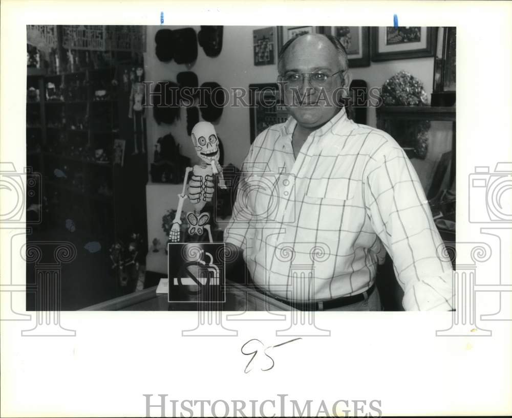 1989 Steve Vollmer with Day of the Dead skeleton at his shop, Texas-Historic Images