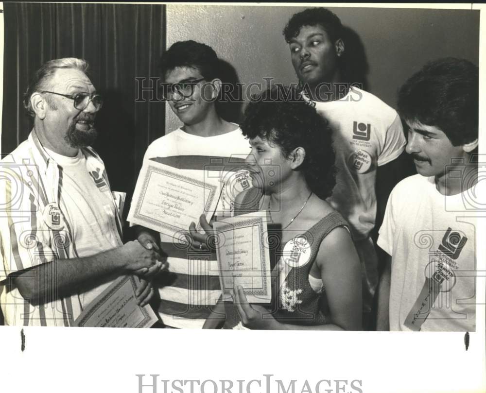 1988 Edgewood High School teacher congratulates students-Historic Images