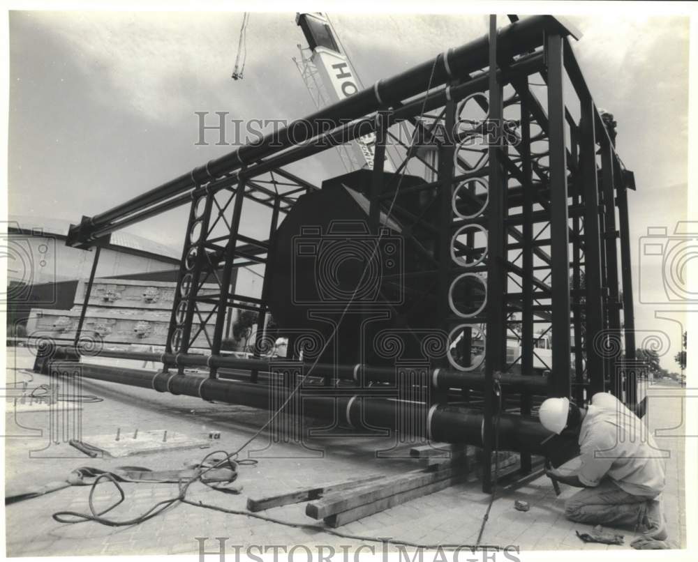 1989 Kevin Hans measures clock tower section at Hemisfair Park-Historic Images