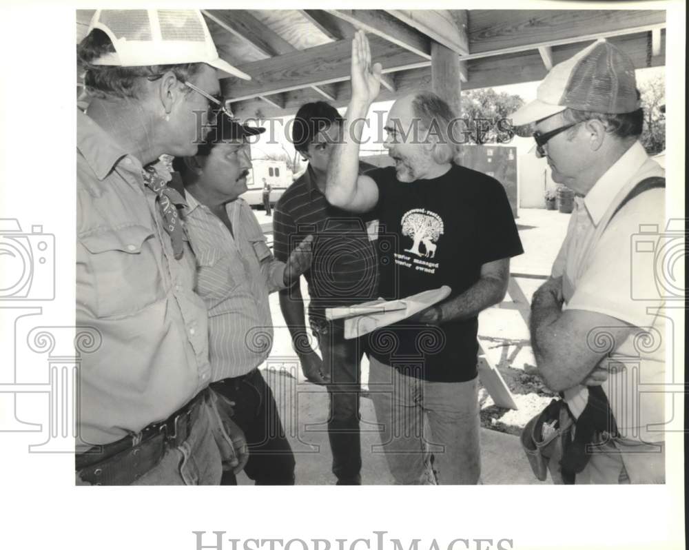 1989 Bob Leathers explains playground gazebo to workers-Historic Images