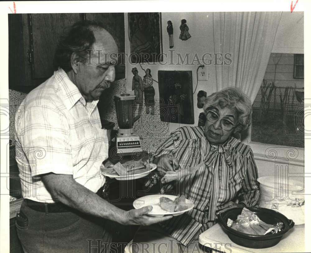 1989 Julio and Herminia Enrique prepare food for playground workers-Historic Images