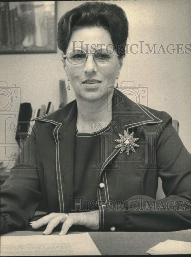 Deputy Mrs. Rosena Gayle sits at her desk-Historic Images