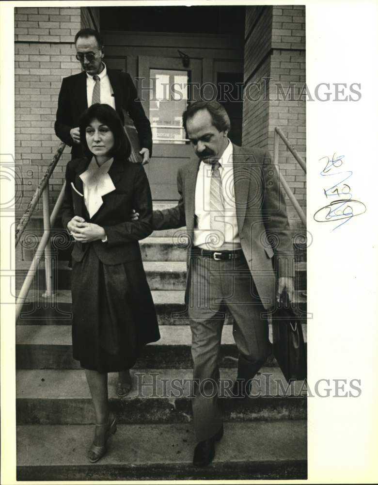 1984 Kathleen Holland escorted by District Attorney officials-Historic Images