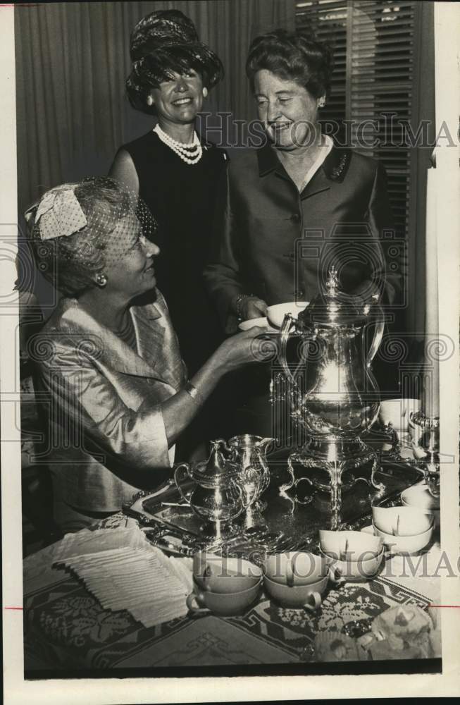 Mrs. C. Dahlen serves tea to Mmes. E.C. Dunn and Guy Meloy-Historic Images