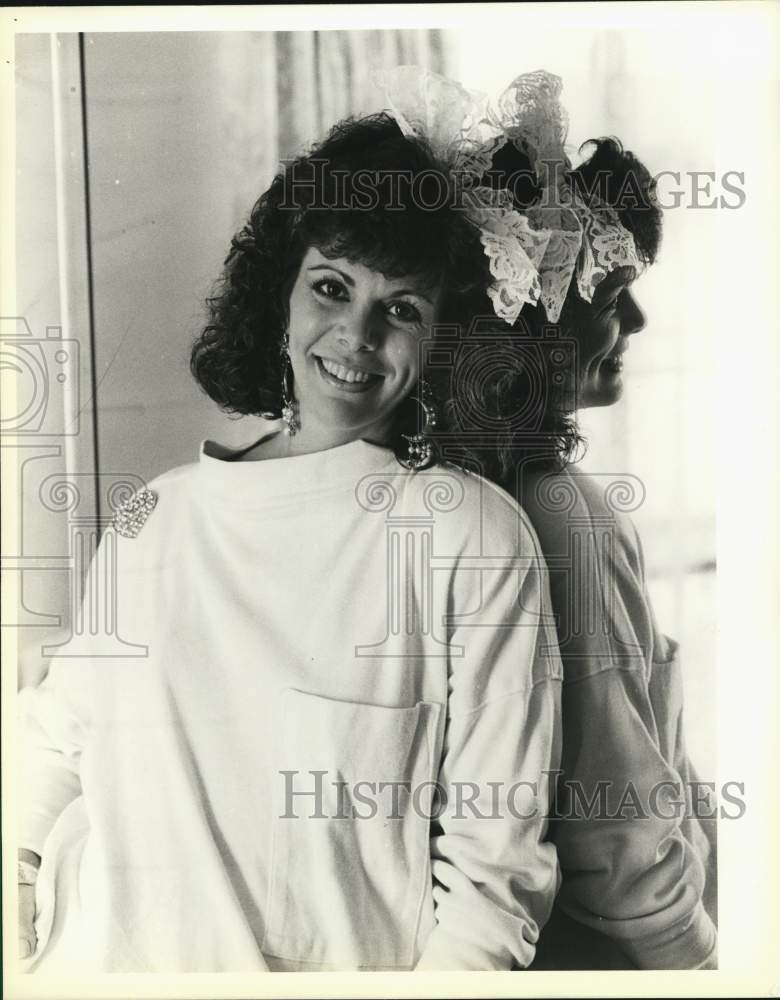 1986 Linda Melendez models a dress and large hair bow-Historic Images