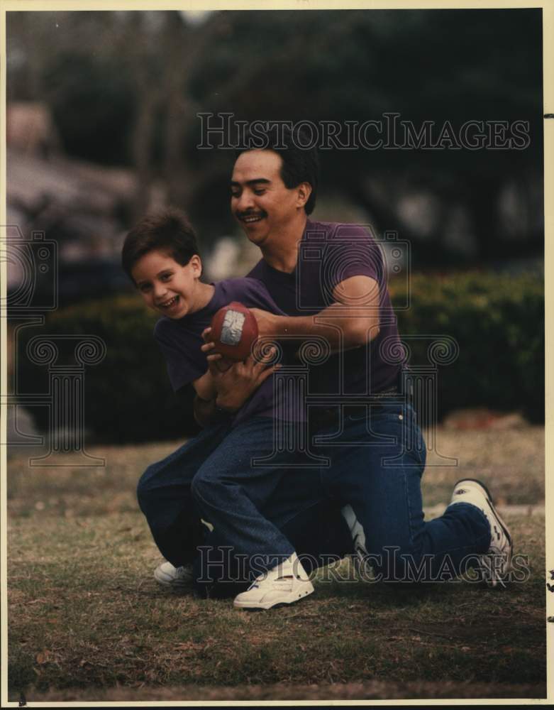 1994 Raymond Martinez, Jr. and Sr. play father/son football-Historic Images