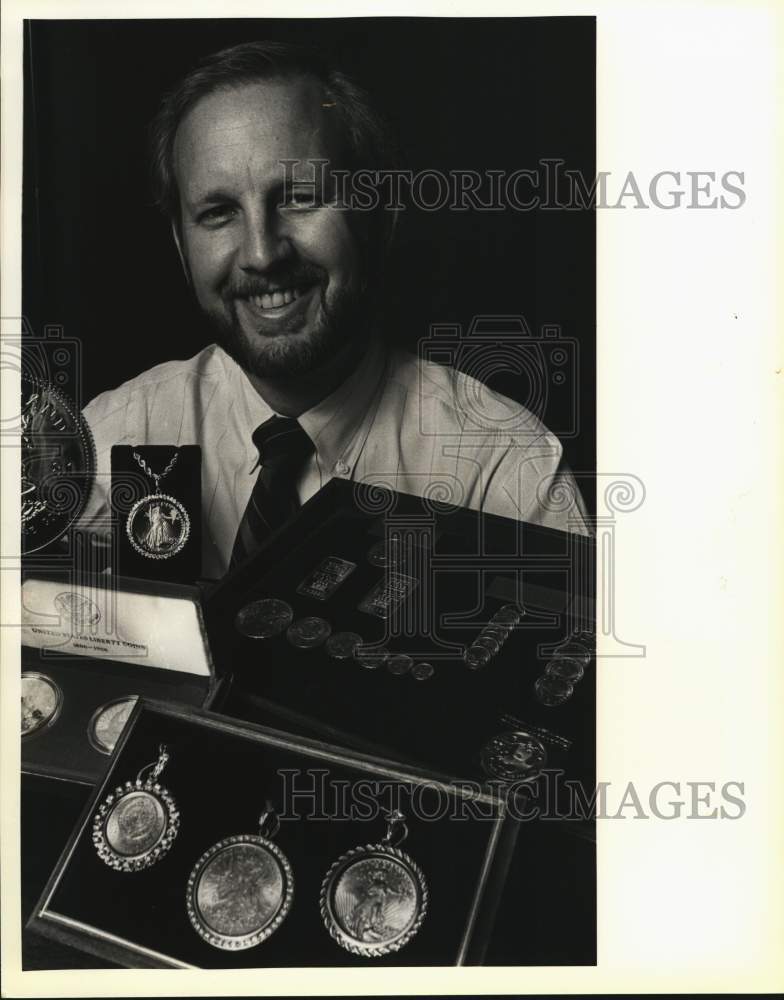 1986 Gene Medlar, coin collector displays his coin collection.-Historic Images