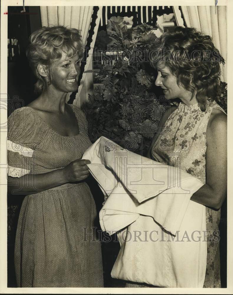 1971 Mrs. Robert M. Marsh and Mrs. Jay S. Honigblum hold fabric-Historic Images