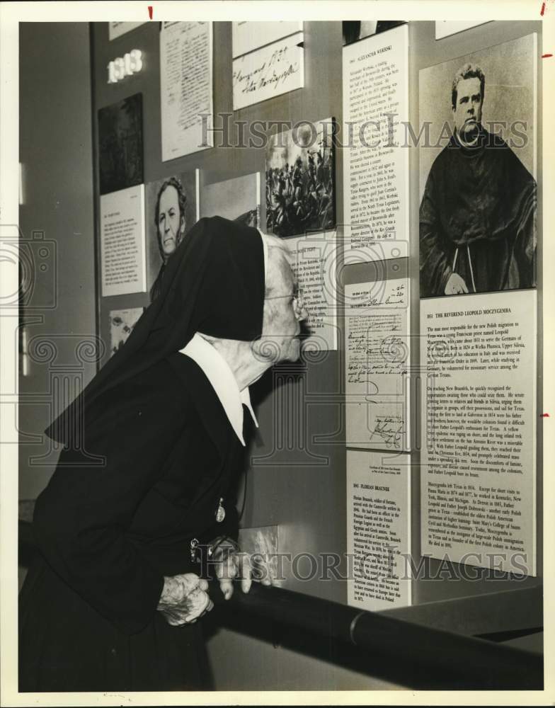 1980 Sister Mary Teresa Krawietz inspecting a document-Historic Images