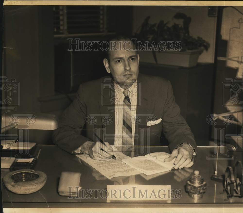 1957 M. Winston Martin sitting at his desk-Historic Images